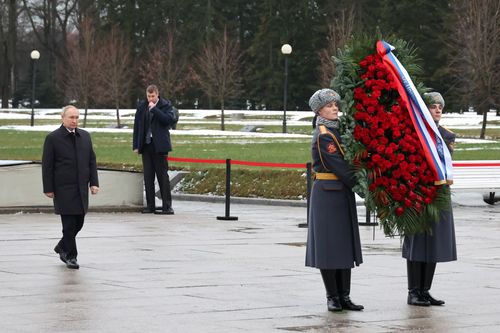 Russian President Vladimir Putin attends events marking the 80th anniversary of the break of Nazi's siege of Leningrad, (now St. Petersburg) during World War Two at the Piskaryovskoye Memorial Cemetery, where hundreds of thousands of siege victims are buried, in St. Petersburg, Russia, Wednesday, Jan. 18, 2023.