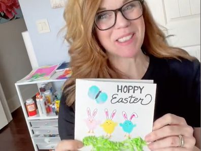 Woman showing her DIY Easter card.