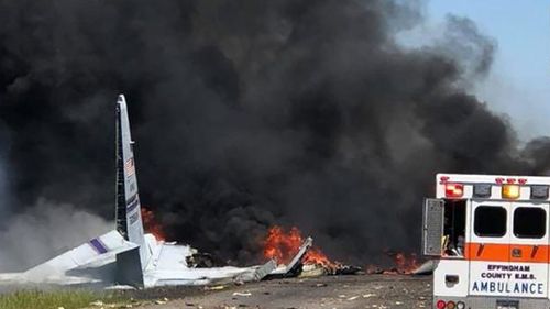 Emergency teams respond to US military plane crash near an International airport in Georgia
