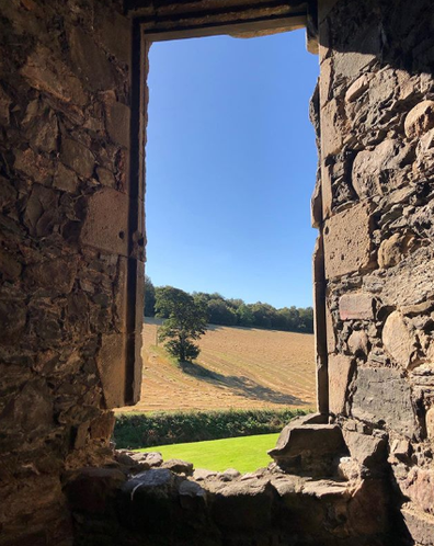 The view from Balvenie Castle to the woods. Please note; not a cloud to be seen. 