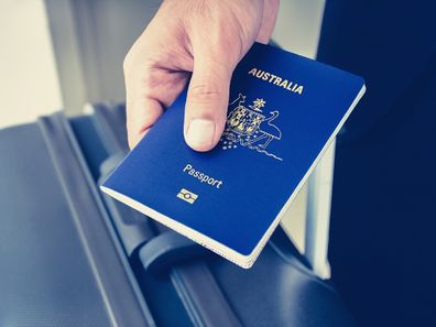 Man holding Australian passport