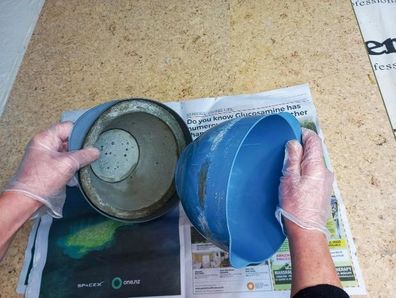 Mould removed from concrete during DIY plant pot project.
