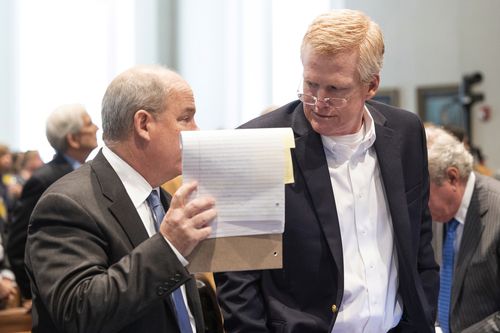 Alex Murdaugh, right, speaks with defense attorney Jim Griffin during a break in his trial for murder at the Colleton County Courthouse in Walterboro, S.C., on Wednesday, Feb. 15, 2023. The 54-year-old attorney is standing trial on two counts of murder in the shootings of his wife and son at their Colleton County, S.C., home and hunting lodge on June 7, 2021. (Joshua Boucher/The State via AP, Pool)