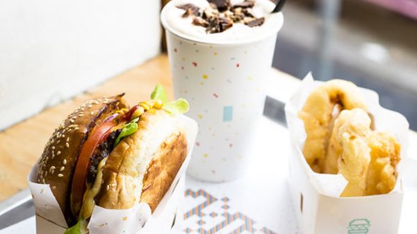8Bit's burger with cheese, beer battered onion rings and peanut butter milkshake
