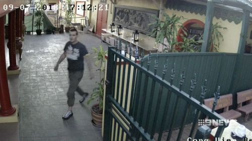 Police are looking for this man, seen pacing erratically at a nearby temple. Officers believe he can help with their investigation. Picture: 9NEWS