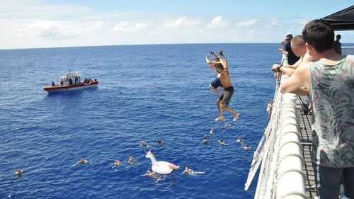 No swimmers were harmed and the according to the coast guard no shots hit the shark. They even managed to save the inflatable unicorn. 