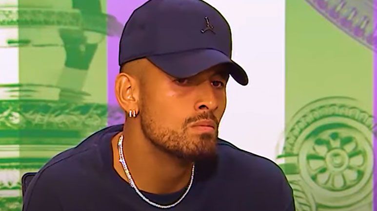 Nick Kyrgios responds to questions at a Wimbledon press conference following his round one win in 2022.