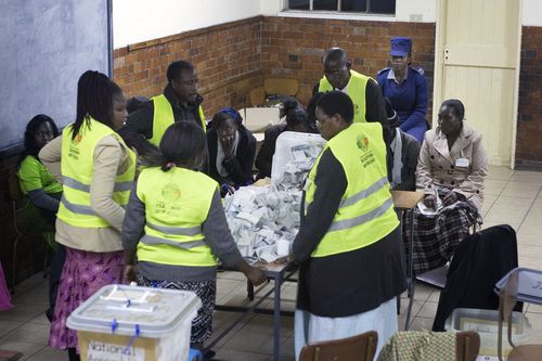 Vote counting starts at a polling station in Bulawayo, Zimbabwe, Monday July 30, 2018. Polls have closed in Zimbabwe's historic election, the first since the fall of longtime leader Robert Mugabe. Millions have voted, turnout was high and the day was free of the violence that marked previous elections. (AP Photo/Jerome Delay