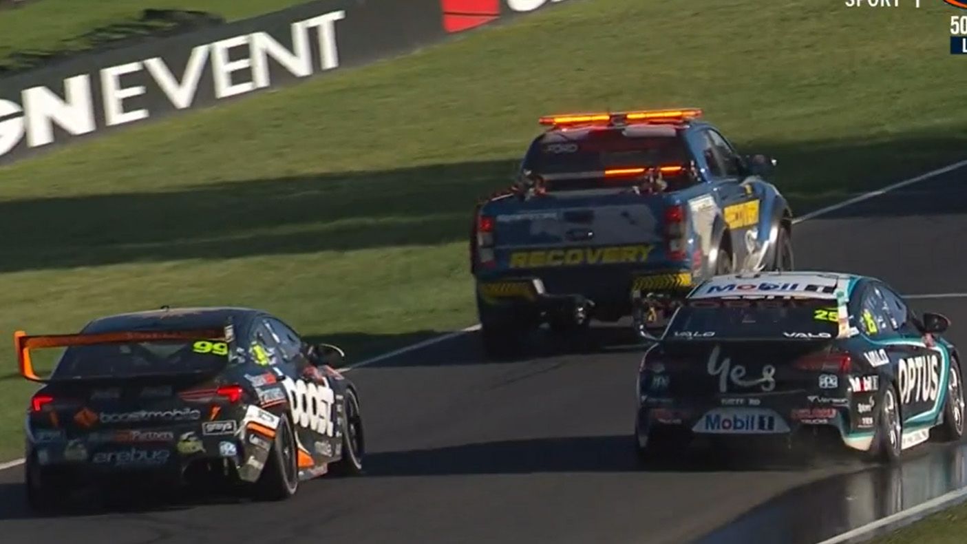 Brodie Kostecki being baulked by a recovery vehicle on Mountain Straight after Will Davison crashed late in the Bathurst 1000.
