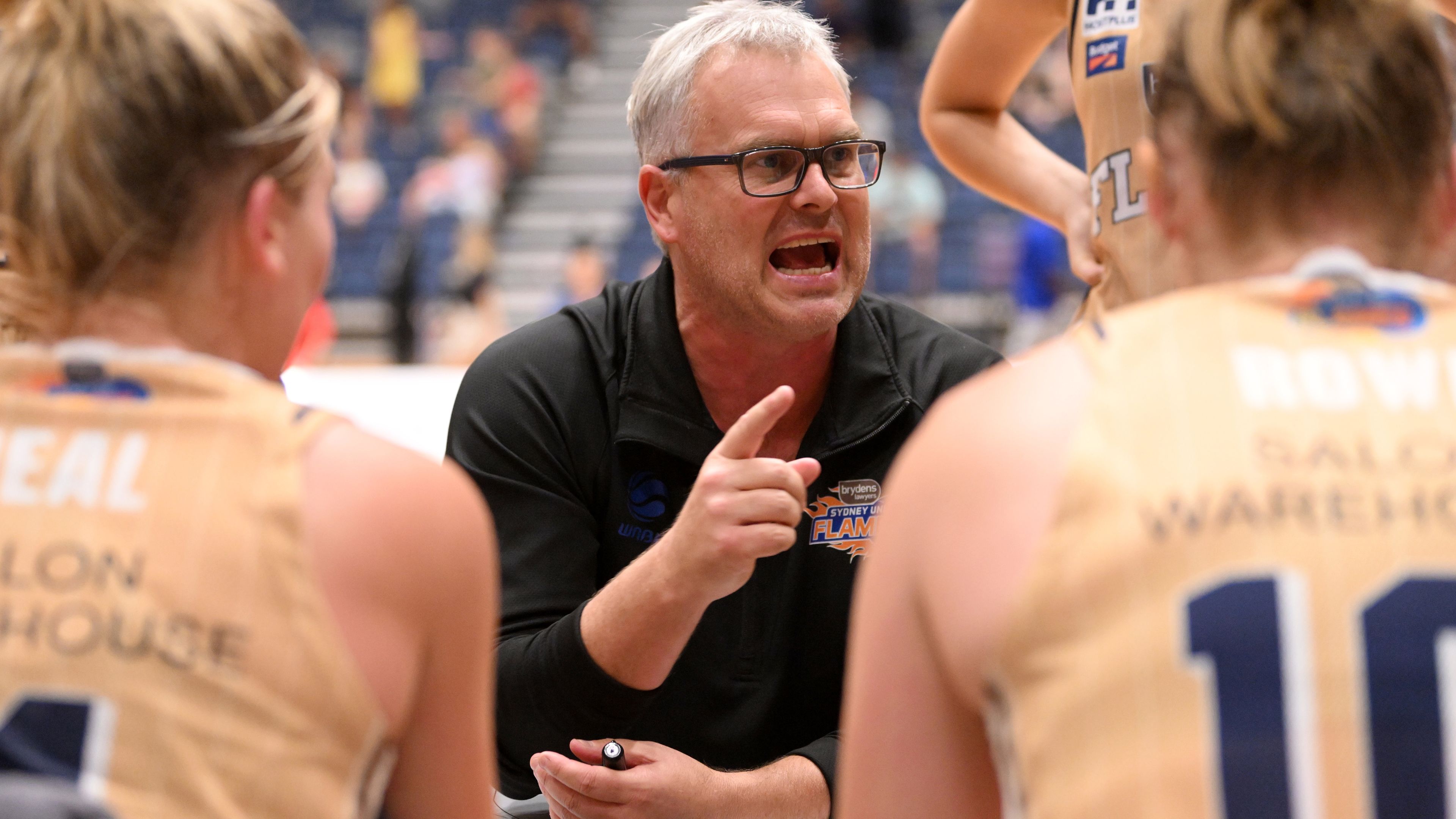 Sydney Flames head coach Shane Heal talks to players. (Photo by Morgan Hancock/Getty Images)