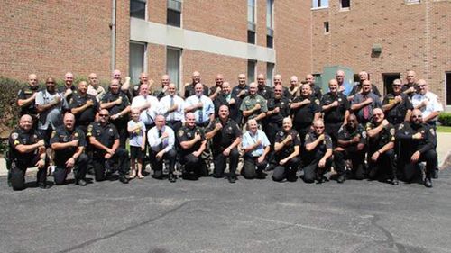 Fifty police officers shave their heads to support co-worker with leukaemia