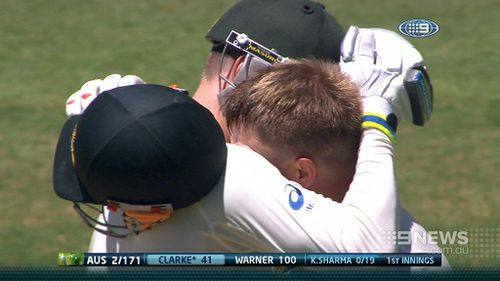 Michael Clarke and David Warner embrace. (9NEWS)