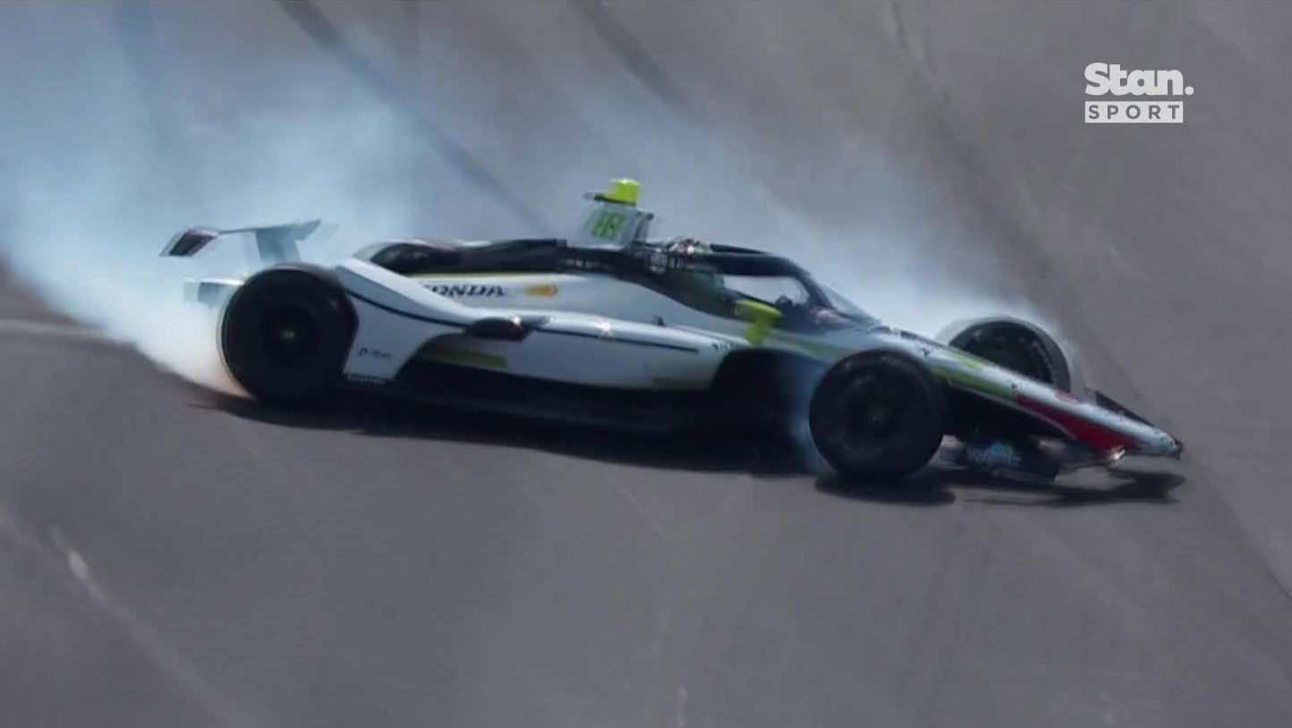 Nolan Siegel spins after hitting the outside wall at turn one in qualifying for the Indianapolis 500.
