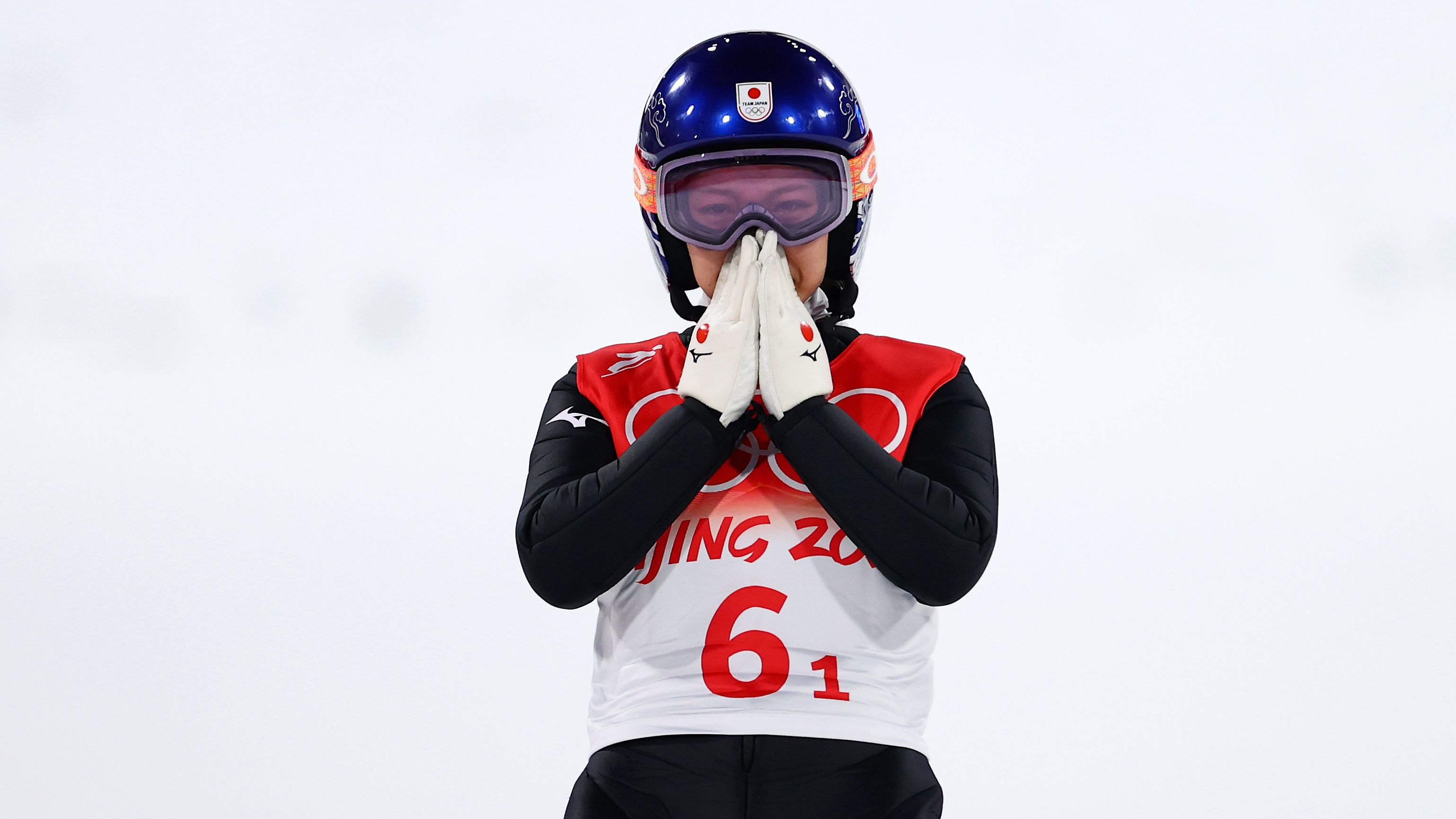 Japan&#x27;s Sara Takanashi looks dejected after being disqualified during mixed team ski jumping final.