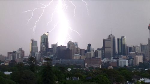 Two people struck by lightning as severe storms lash Sydney