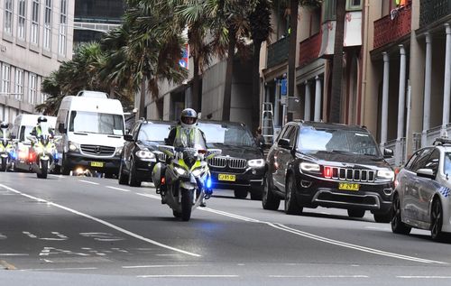 The former president's motorcade shut down Sydney streets as he made his way to his hotel. (AAP)