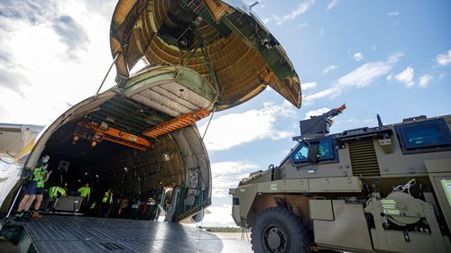 Bushmaster vehicle loaded onto cargo aircraft