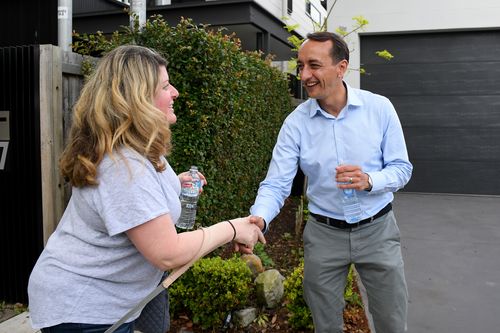 Liberal candidate for Wentworth Dave Sharma is seen handing out how to vote cards near a polling place at Rose Bay.