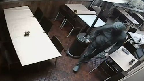 CCTV showed a masked man in the restaurant, who police allege was the restaurateur himself.