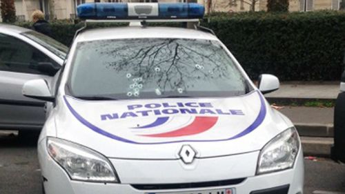 The windscreen of a police car is littered with bullet holes after the Paris shooting. (Getty)