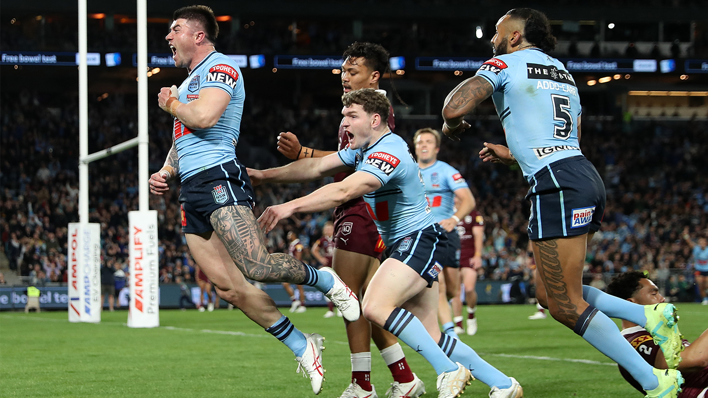 Bradman Best of the Blues celebrates scoring a try during game three of the State of Origin series.