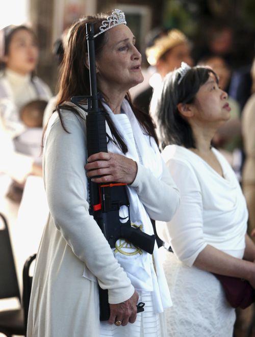 Young women are encouraged to express their love of the AR-15 as members of the church. (AAP)