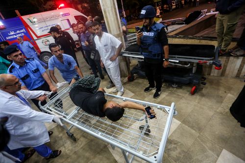 Palestinians injured in Israeli air raids arrive at Nasser Medical Hospital