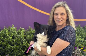 Cynthia Hornor poses with Nimble, the first mixed-breed dog ever to win the Westminster Kennel Club dog show&#x27;s agility competition, on the show grounds at the USTA Billie Jean King National Tennis Center in New York, Monday, May 13, 2024. (AP Photo/Jennifer Peltz)