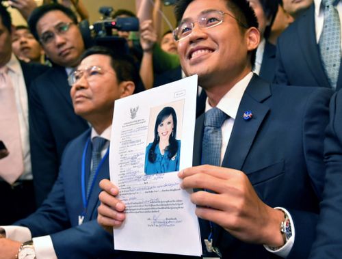 Thai Raksa Chart Party leader Preechapol Pongpanich shows a document nominating Princess Ubolratana Mahidol as candidate for prime minister.