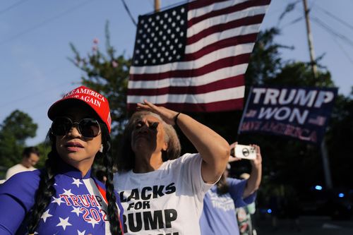 Former President Donald Trump's supporters gather outside of the Fulton County Jail, Thursday, Aug. 24, 2023, in Atlanta 