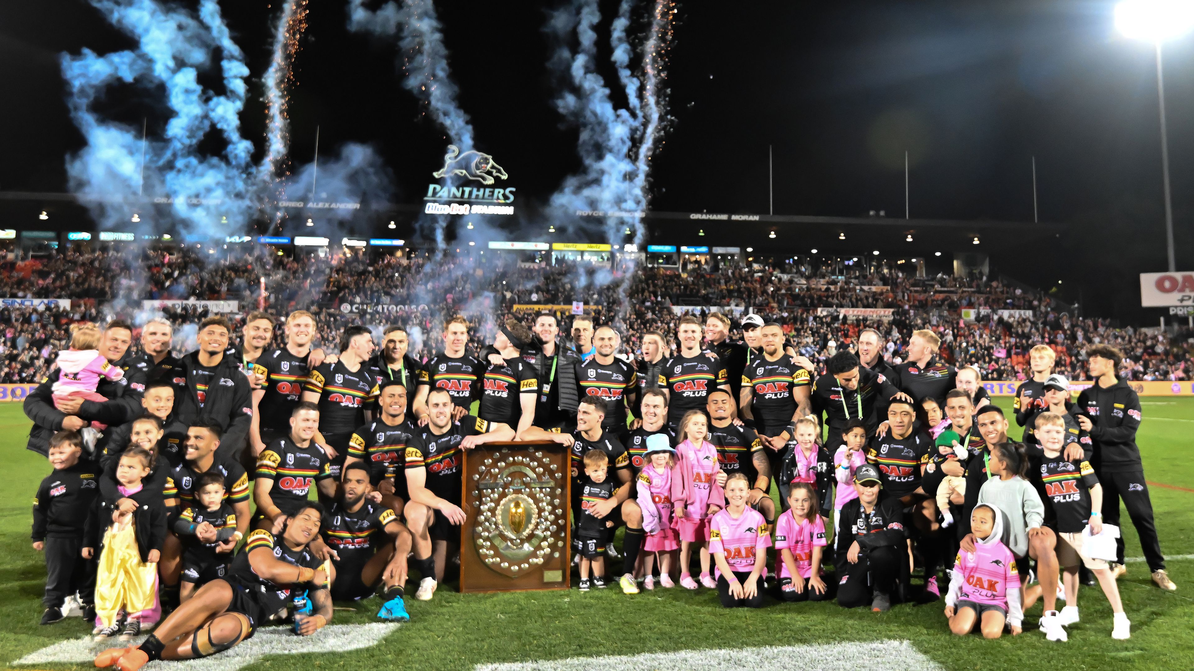 The Penrith Panthers celebrate with the J.J. Giltinan Shield after winning the minor premiership in season 2023.