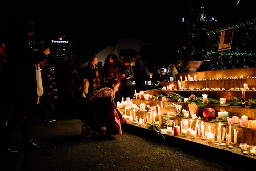 Candles are lit at the vigil in Elder Park, Adelaide. PIcture: AAP