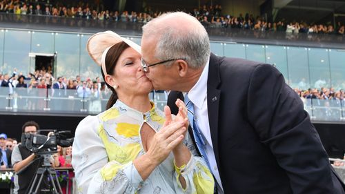 Scott Morrison kisses wife Jenny after watching champion racehorse Winx win the Queen Elizabeth Stakes at Royal Randwick.