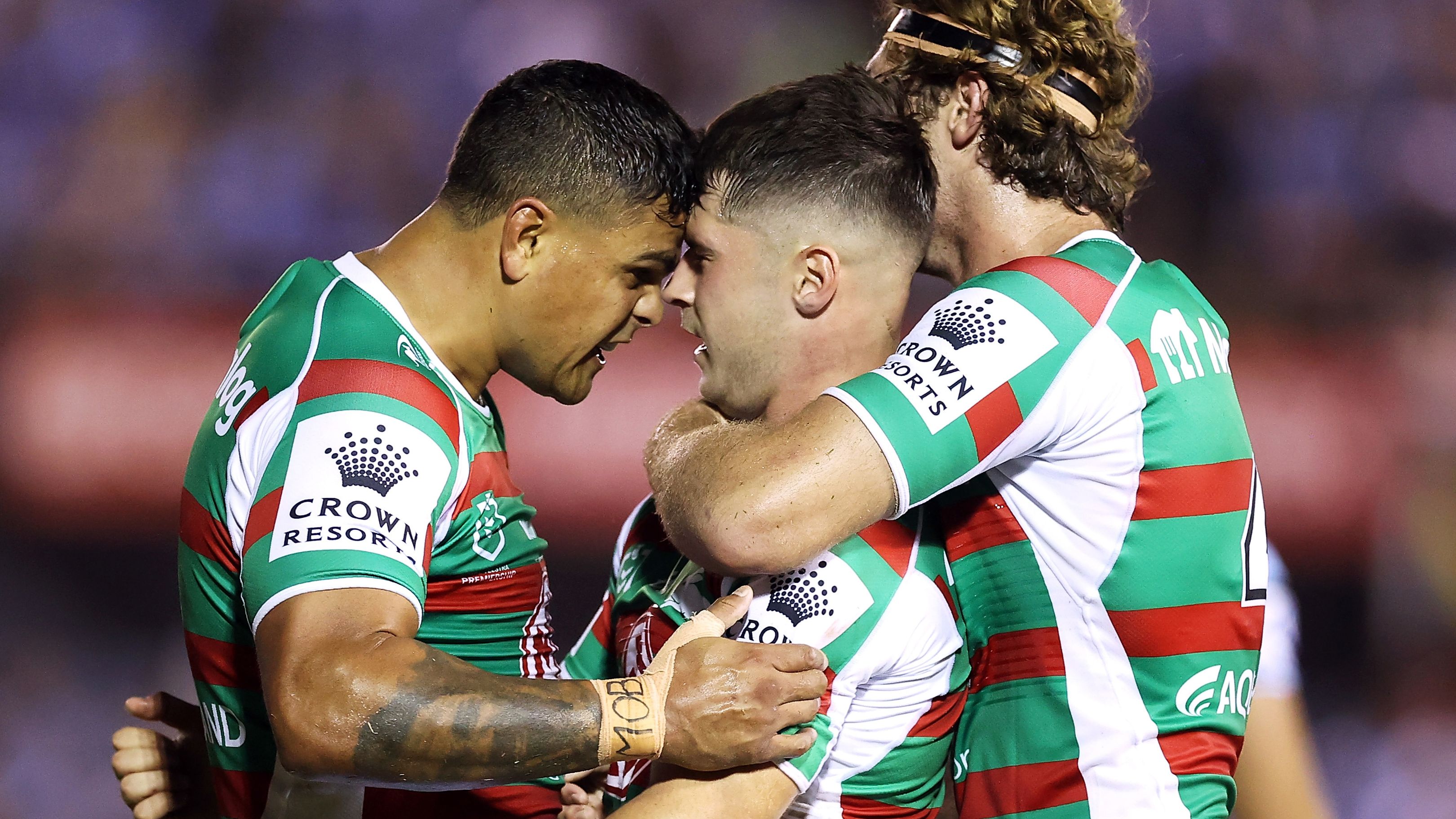 Latrell Mitchell (l) and Campbell Graham (r) of the Rabbitohs celebrate with Lachlan Ilias (c) of the Rabbitohs during the round one NRL match between Cronulla Sharks and South Sydney Rabbitohs at BlueBet Stadium on March 04, 2023 in Cronulla, Australia. (Photo by Mark Kolbe/Getty Images)