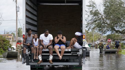 People are evacuated from floodwaters in the aftermath of Hurricane Ida in LaPlace, Louisiana.