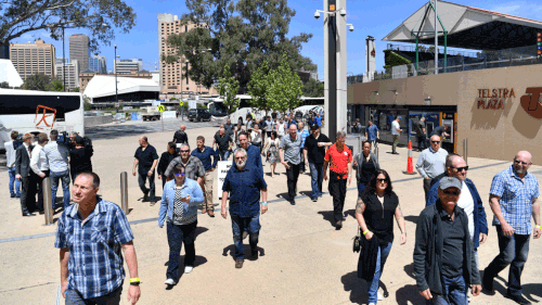 Former Holden employees are seen walking into Adelaide Oval for a gathering on the last day of production. (AAP)