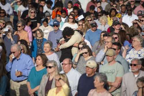Community members embrace during a prayer vigil at First Baptist Church in Dadeville, Ala., on Sunday, April 16, 2023.  