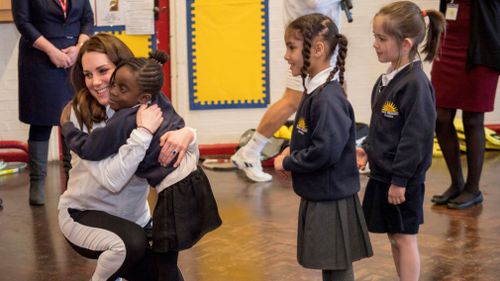 Pupils patiently waited their turn for a hug with the princess. (Getty Images)
