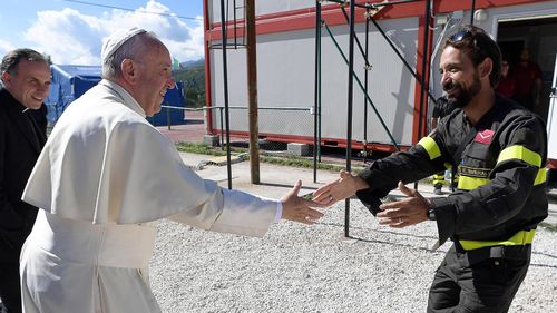 Pope in emotion-charged visit to Italy quake zone