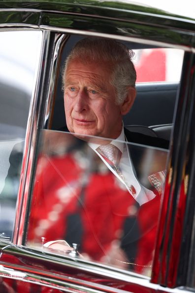 King Charles pictured in 2022, looking out of a car window.