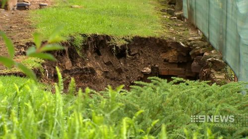 The sinkholes opened up after heavy rain. (9NEWS)