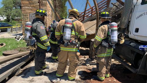 Pedestrian bridge collapses onto DC highway, injuring several people