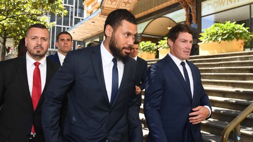 Canterbury Bankstown Bulldogs NRL players Adam Elliott (2nd from left), Asipeli Fine (centre) and team captain Josh Jackson (right) leave the Downing Centre Court following an adjournment in Sydney Monday, December, 17, 2018. 