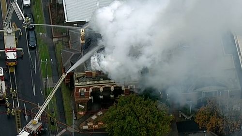 Up to 50 fire fighters have struggled to contain a blaze at heritage-listed building in Melbourne. (9NEWS)