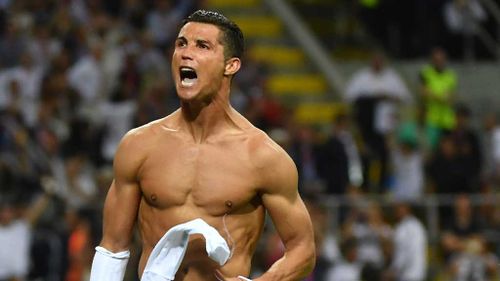 Real Madrid's Portuguese forward Cristiano Ronaldo celebrates after Real Madrid won the UEFA Champions League final football match over Atletico Madrid at San Siro Stadium in Milan. (AFP)
