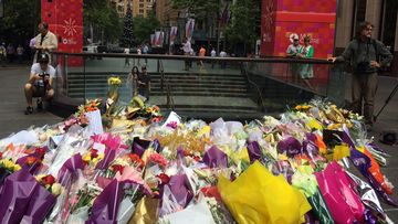 A sea of flowers rests on the pavement in Martin Place. (Supplied)