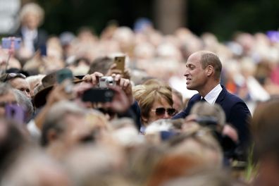 Prince William meets members of the public after viewing floral tributes to late Queen Elizabeth II at the gates of Sandringham House in Norfolk, Thursday Sept. 15, 2022.