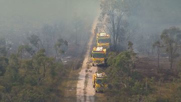 Firefighters in Queensland are tackling two separate fast-moving bushfires burning on the Sunshine Coast. Queensland Fire and Emergency Service (QFES) issued an emergency warning for people in the Beerwah area after a fire broken containment lines in﻿ Glass House Mountains National Park.