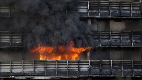 Firefighters were battling a blaze on Sunday that spread rapidly through a recently restructured 60-meter-high, 16-story residential building in Milan. 