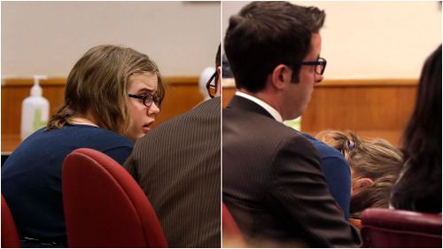 Morgan Geyser buries her head in her hands after learning her fate in the courtroom. (AAP)